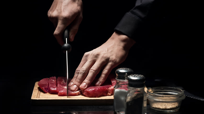 Chef preparing steak 