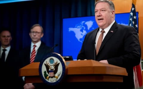 Mike Pompeo announcing the decision at the US State Department in Washington - Credit: AFP