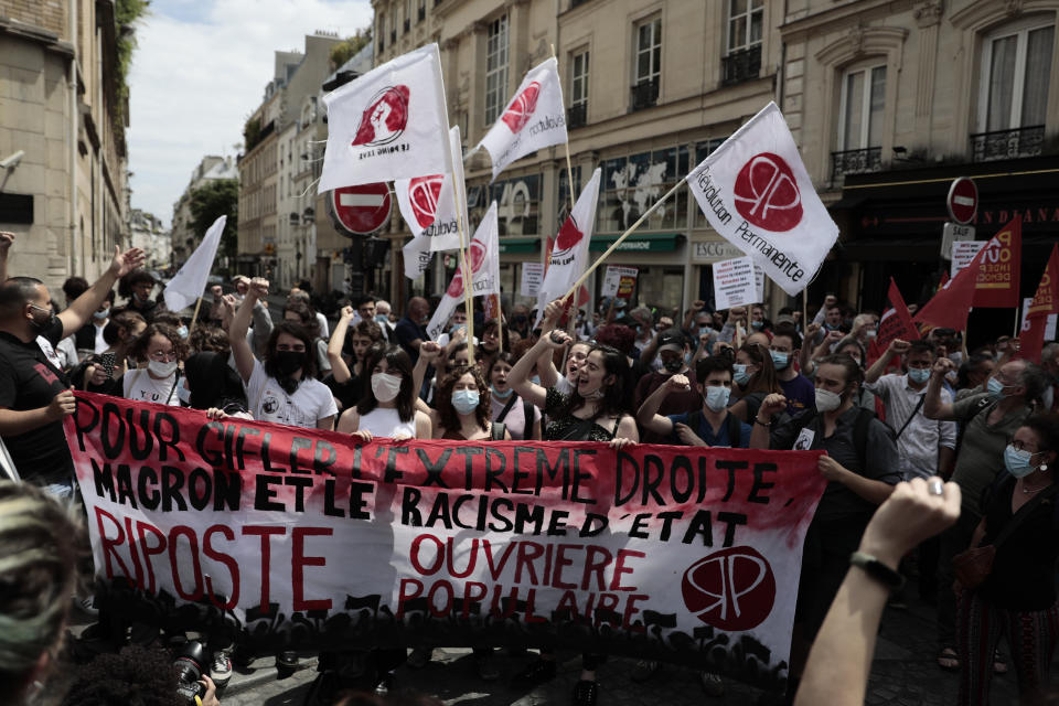 Demonstrators gather during a demonstration, Saturday, June 12, 2021 in Paris. Thousands of people rallied throughout France Saturday to protest against the far-right. (AP Photo/Lewis Joly)