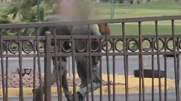 Officers are seen rushing K9 officer Enzo to a helicopter to transport him to another veterinary medical facility (LVMPD)