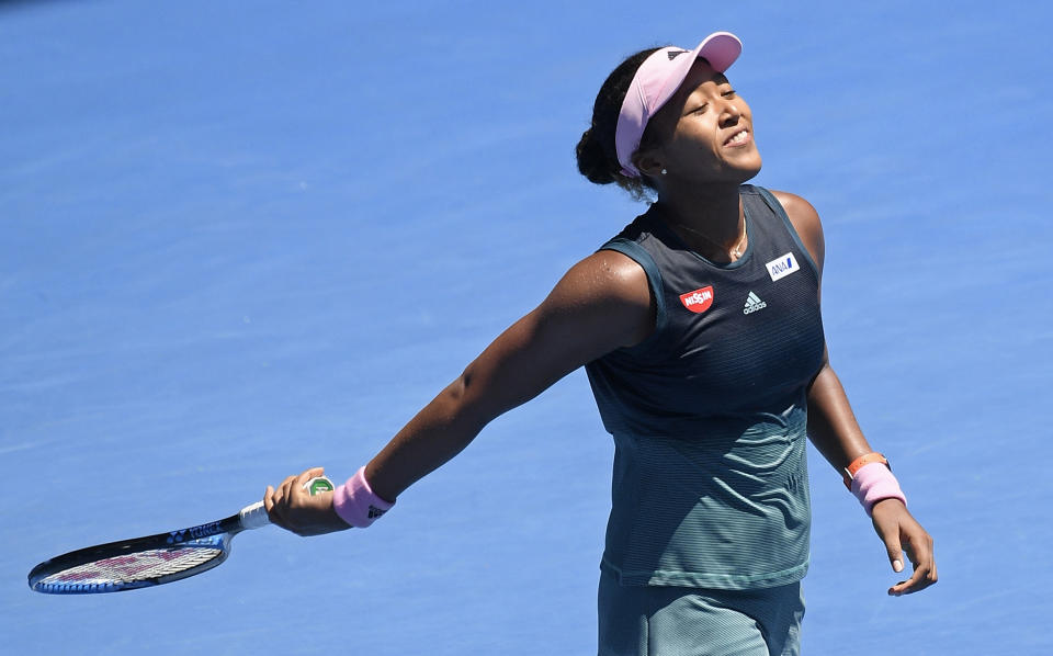 Japan's Naomi Osaka celebrates after defeating Latvia's Anastasija Sevastova during their fourth round match at the Australian Open tennis championships in Melbourne, Australia, Monday, Jan. 21, 2019. (AP Photo/Andy Brownbill)