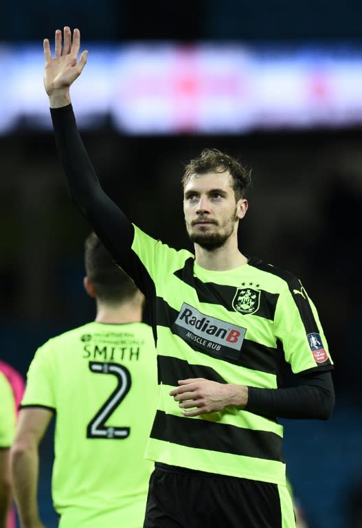 Huddersfield Town's Serbian defender Jon Stankovic waves to the fans following their FA Cup fifth round replay against Manchester City at the Etihad Stadium in Manchester, northwest England, on March 1, 2017