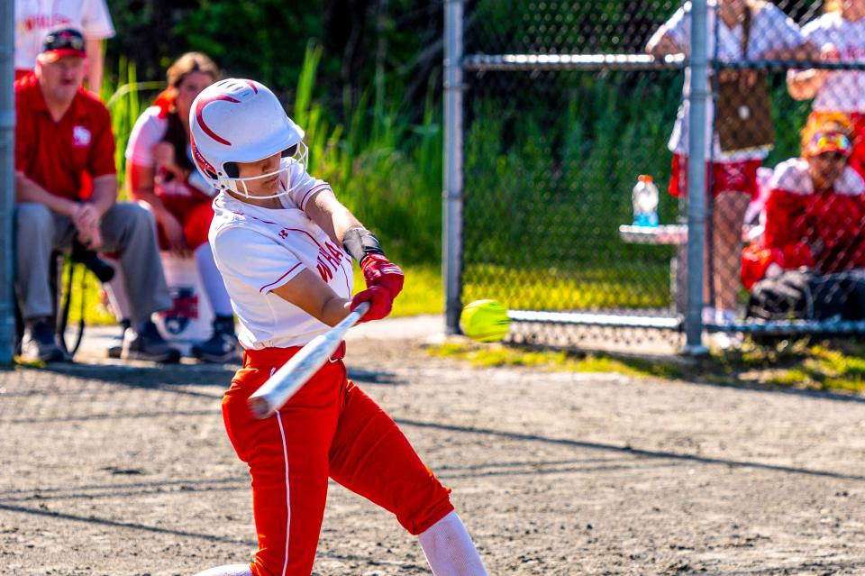 New Bedford's Amelia Davis drives the ball to center field.