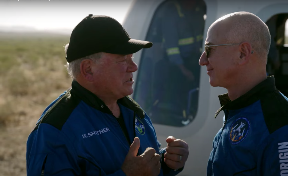 Actor William Shatner speaks with Jeff Bezos, founder of Blue Origin, a private space flight company, after Shatner landing in the New Shepard rocket capsule near Van Horn, Tex. on Oct. 13, 2021<span class="copyright">Blue Origin livestream</span>