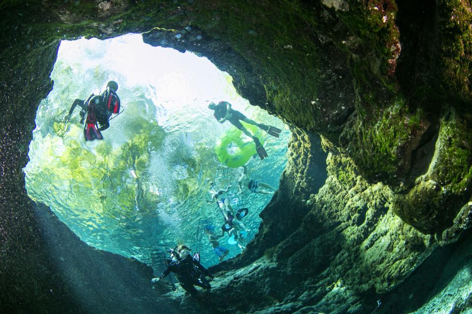 Swimmers and divers enjoy Devils Eye in Ginnie Springs Outdoors park in High Springs.