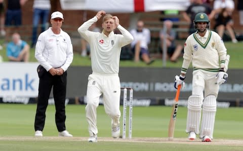 England's Joe Root (C) reacts after delivering a ball as South Africa's Keshav Maharaj (R) and umpire Rod Tucker (L) look on - Credit: Richard Huggard AFP via Getty Images