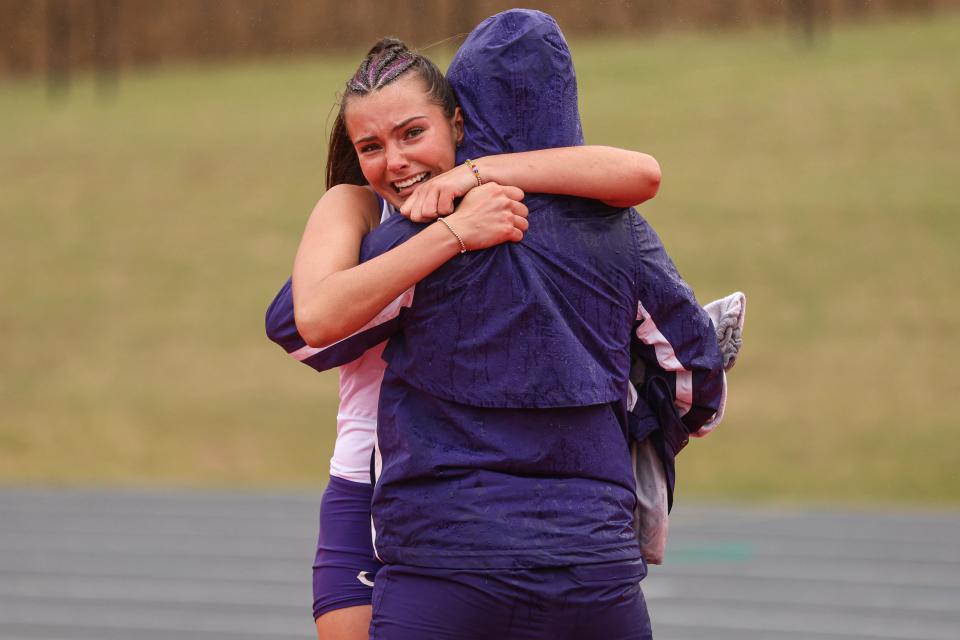 Canyon's Brooklyn Kinsey celebrates second place in the 100-meter hurdle race with a teammate in the Region I-4A track and field meets, Saturday, April 20, 2024, at the Lowrey Field.