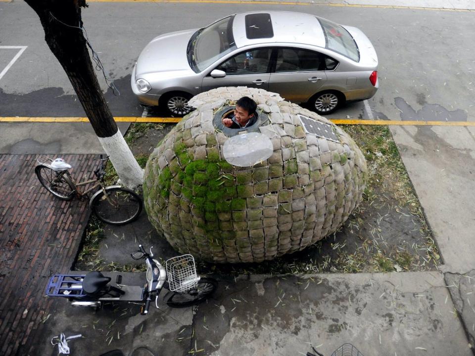 Dai Haifei inside his egg-shaped home.