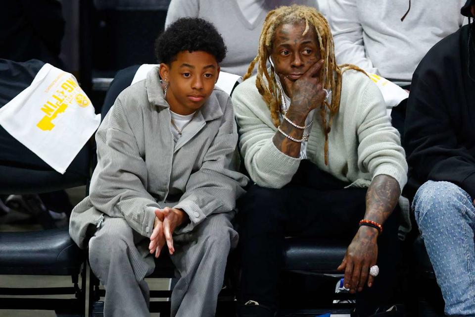 <p>Justin Edmonds/Getty</p> Lil Wayne and son Kameron