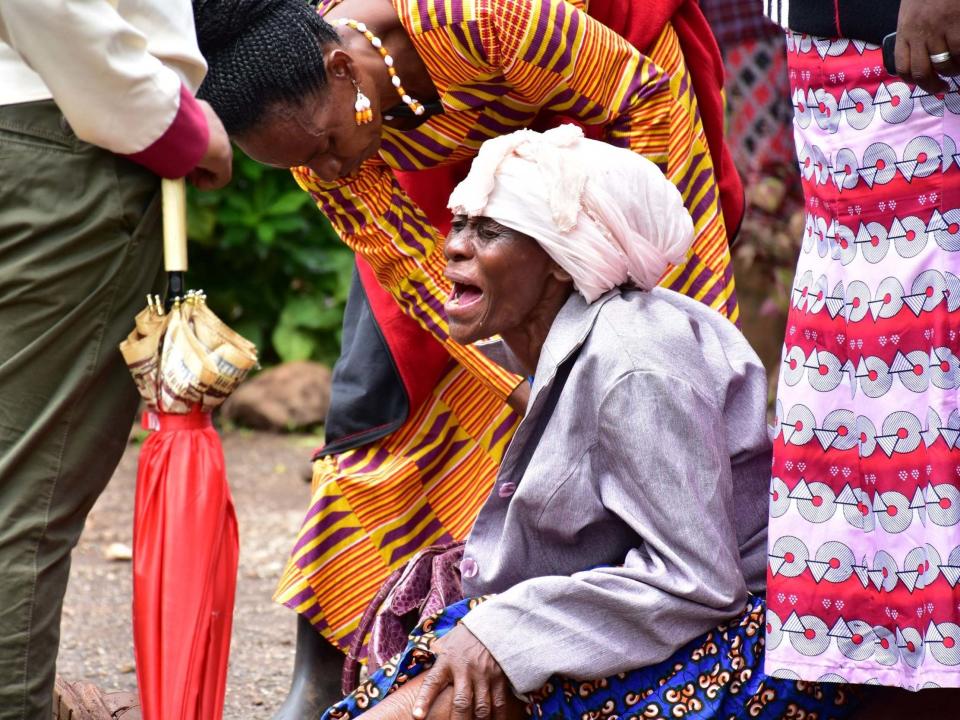 Moshi residents in Kilimanjaro region grieve at Mawenzi hospital after the death of her granddaughter who was killed in stampede: AFP via Getty Images