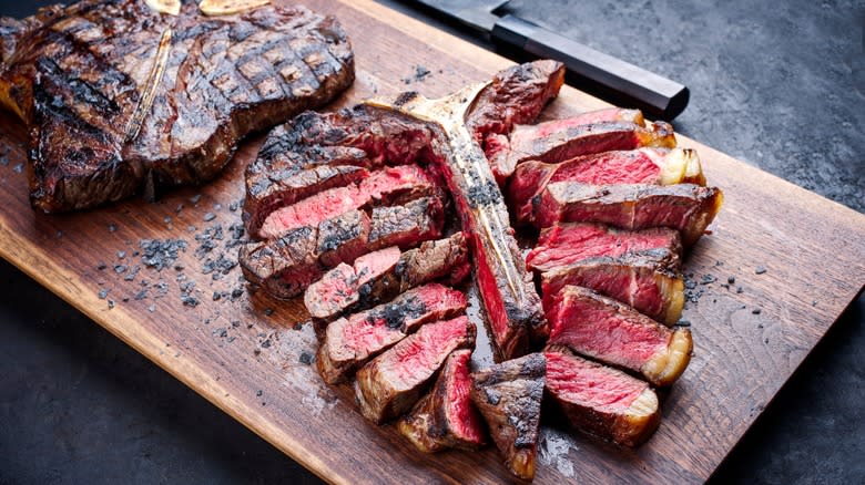 Porterhouse steaks on cutting board