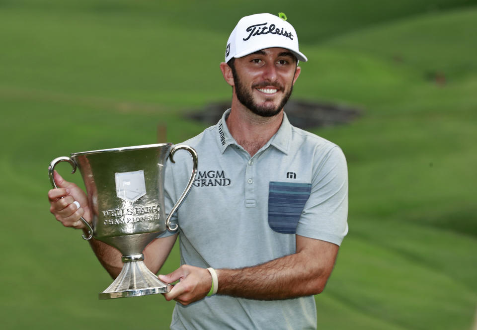 Max Homa poses with the trophy after winning the Wells Fargo Championship golf tournament at Quail Hollow Club in Charlotte, N.C., Sunday, May 5, 2019. (AP Photo/Jason E. Miczek)