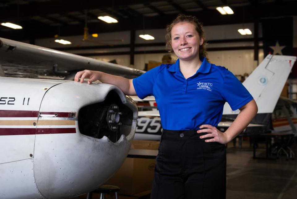 Elaine Polster, a recent graduate of the pilot program and incoming Certified Flight Instructor, stands inside the Maintenance Hanger where students learn to fix mechanical issues on grounded aircraft at the Texas State Technical College in Waco on Oct. 24, 2022.