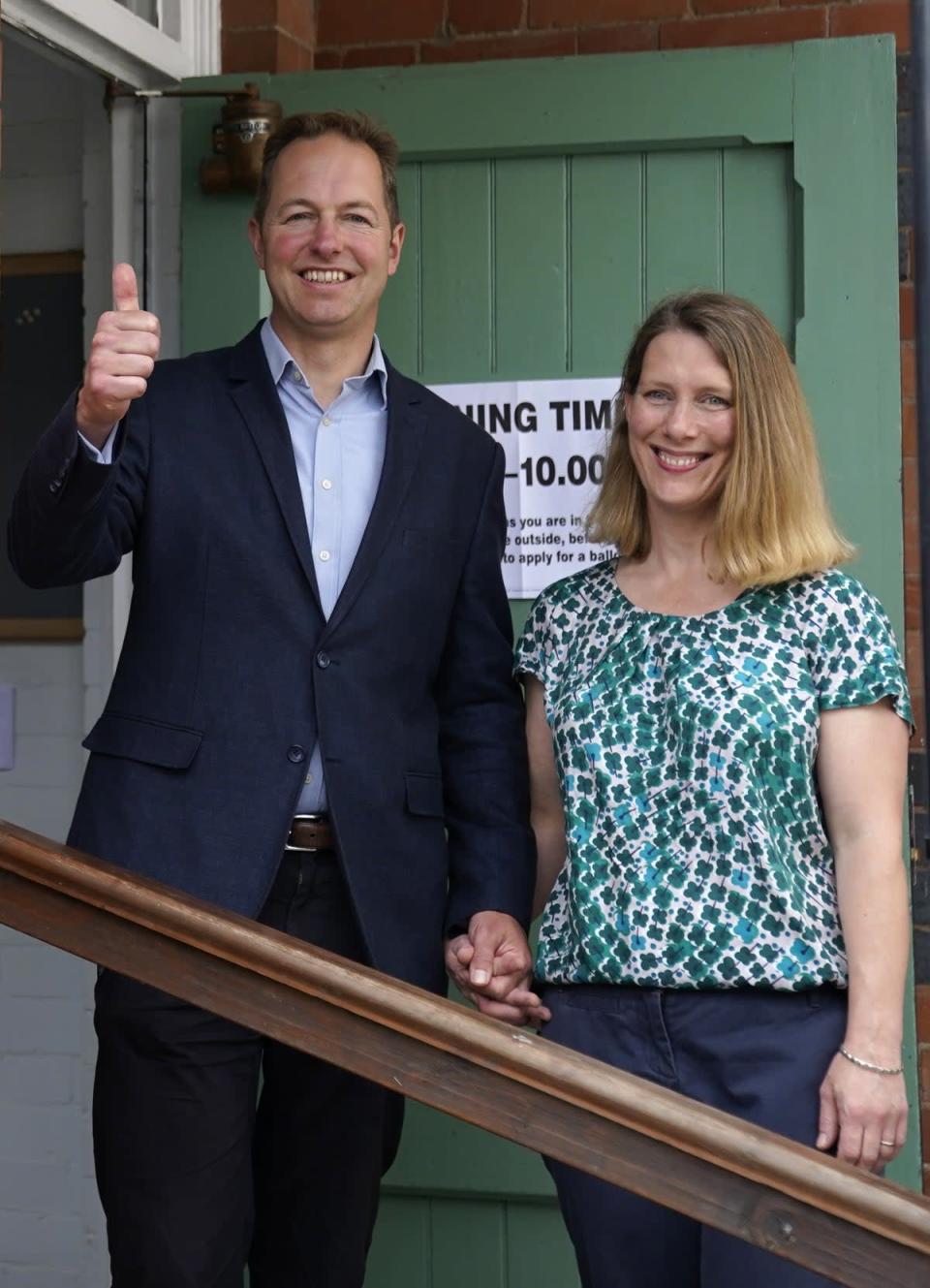 The Liberal Democrats’ by-election candidate Richard Foord (left) poses for a photograph with his wife Kate after they cast their votes (Andrew Matthews/PA) (PA Wire)