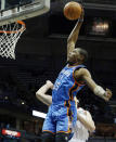 Oklahoma City Thunders' Kevin Durant dunks against Milwaukee Bucks' Ersan Ilyasova, right, during the first half of an NBA basketball game Monday, April 9, 2012, in Milwaukee. (AP Photo/Jeffrey Phelps)