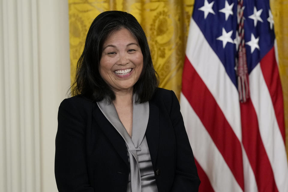 Julie Su, nominated by President Joe Biden to serve as the Secretary of Labor, listens as Biden speaks about her during an event in the East Room of the White House in Washington, Wednesday, March 1, 2023. (AP Photo/Susan Walsh)