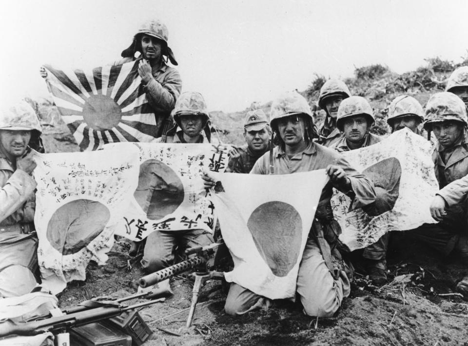 U.S. Marines of the 5th Division captured Japanese battle flags at Iwo Jima on March 2, 1945.