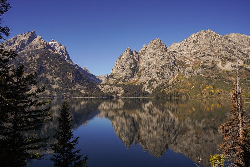 Jenny Lake mirrors the mountains at Grand Teton National Park.