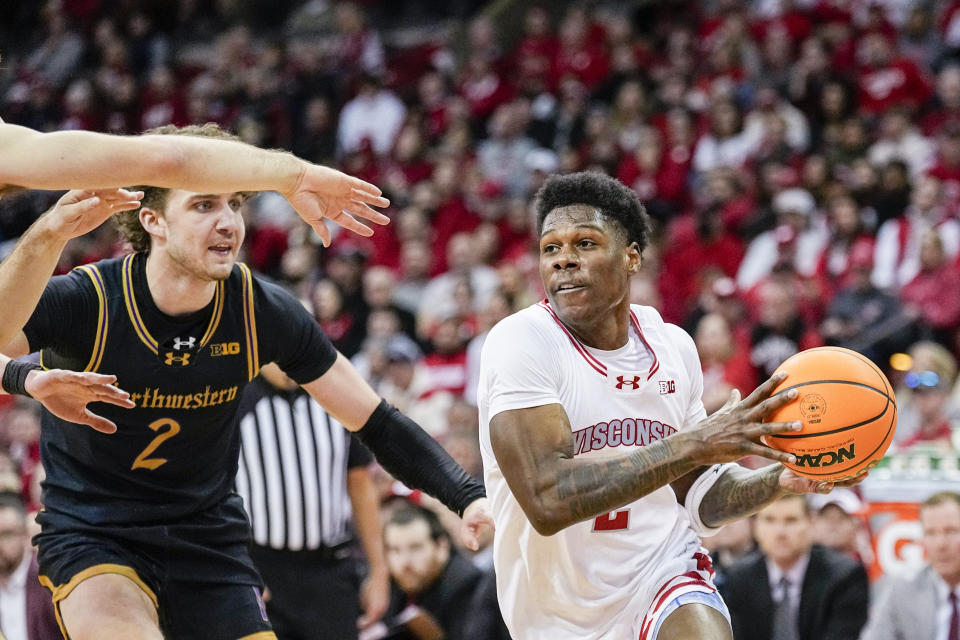 Wisconsin's AJ Storr (2) drives past Northwestern's Nick Martinelli (2) during the second half of an NCAA college basketball game Saturday, Jan. 13, 2024, in Madison, Wis. (AP Photo/Andy Manis)