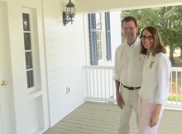 Jim Carter stands with Margaret Williams, who researched the history of the Osborn House after Carter began his restoration of the 200-year-old house.