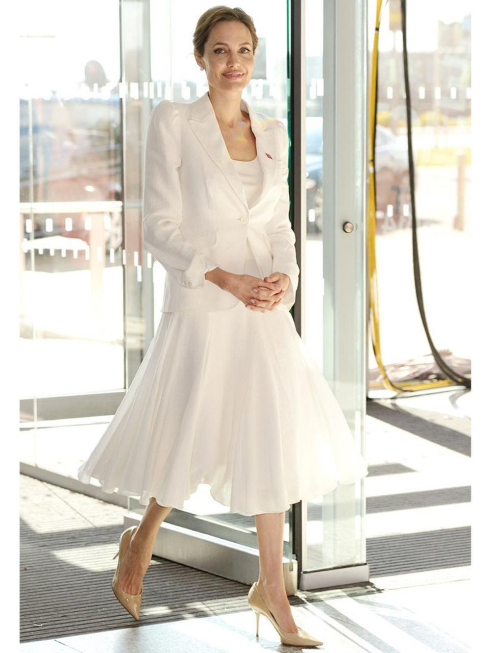 <p>Angelina Jolie wears all-white <a href="http://www.elleuk.com/catwalk/designer-a-z/michael-kors/spring-summer-2014/collection" rel="nofollow noopener" target="_blank" data-ylk="slk:Michael Kors s/s 2014;elm:context_link;itc:0;sec:content-canvas" class="link ">Michael Kors s/s 2014</a> separates with nude Agnes Jimmy Choo heels to the Global Summit to end Sexual Violence in Conflict, London.</p>