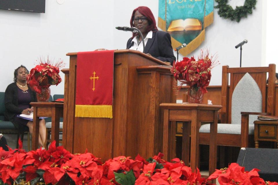 The Rev. Dr. Marie Herring of DaySpring Baptist Church delivers the sermon during a Watch Night Service held at the church on New Year's Eve.
(Photo: Photo by Voleer Thomas/For The Guardian)