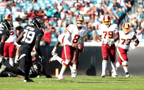 Washington Redskins quarterback Josh Johnson (8) runs with the ball against the Jacksonville Jaguars during the second half at TIAA Bank Field - Credit: Kim Klement/USA TODAY