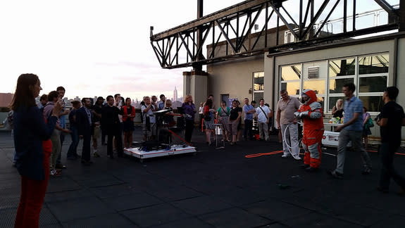 Final Frontier Design's Ted Southern and Nikolay Moiseev demonstrate their company's Spacesuit Experience, which allows customers to try on a pressurized spacesuit, during an invite-only event on a rooftop at the Brooklyn Navy Yard in Brooklyn,