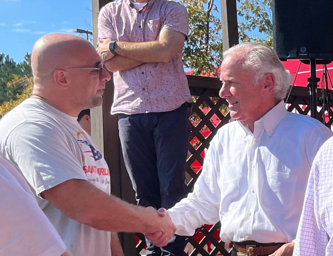 Gov. Henry McMaster shakes hands with supporters at a rally at the Okatie Ale House in Bluffton Wednesday ahead of the midterms.