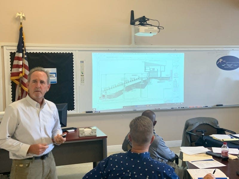 Scott Donald, a senior project manager with LS3P, presented to the school board schematic designs on Madison High School's stadium renovations June 27.