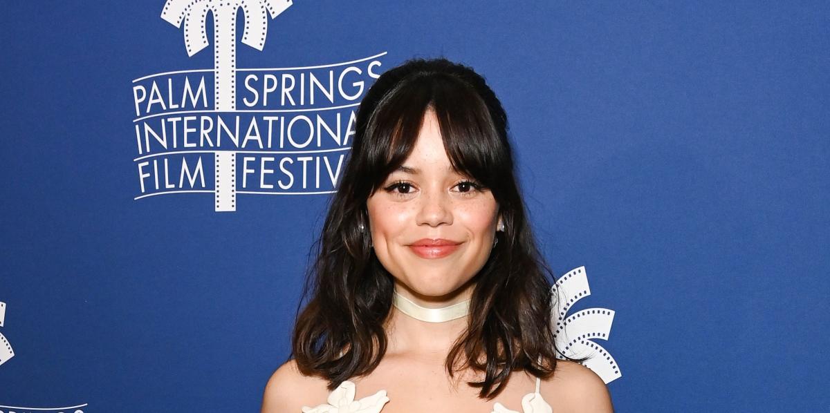 Jenna Ortega dazzles in a white micro-mini dress with floral nipple pasties