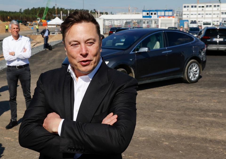 Tesla CEO Elon Musk talks to media as he arrives to visit the construction site of the future US electric car giant Tesla, on September 03, 2020 in Gruenheide near Berlin. - Tesla builds a compound at the site in Gruenheide in Brandenburg for its first European 