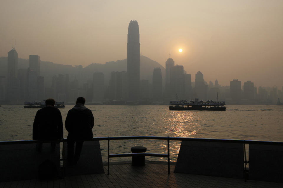 In this Jan. 11, 2013 photo, two cross-harbor Star Ferry sail across the Victoria Harbor with the background of the Hong Kong Island's legendary skyline. With its bustling harbor and glittering, neon-drenched skyscrapers set against a backdrop of verdant, towering peaks, Hong Kong is undeniably one of the world's most scenic cities. (AP Photo/Kin Cheung)