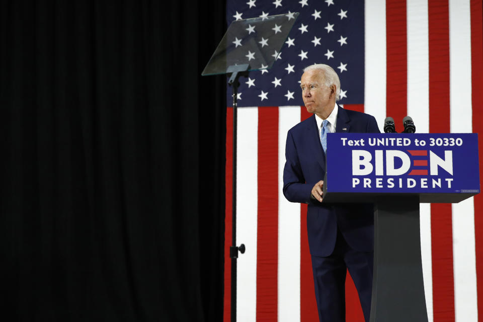 Democratic presidential candidate, former Vice President Joe Biden listens to a reporter's question as he speaks at Alexis Dupont High School in Wilmington, Del., Tuesday, June 30, 2020. (AP Photo/Patrick Semansky)