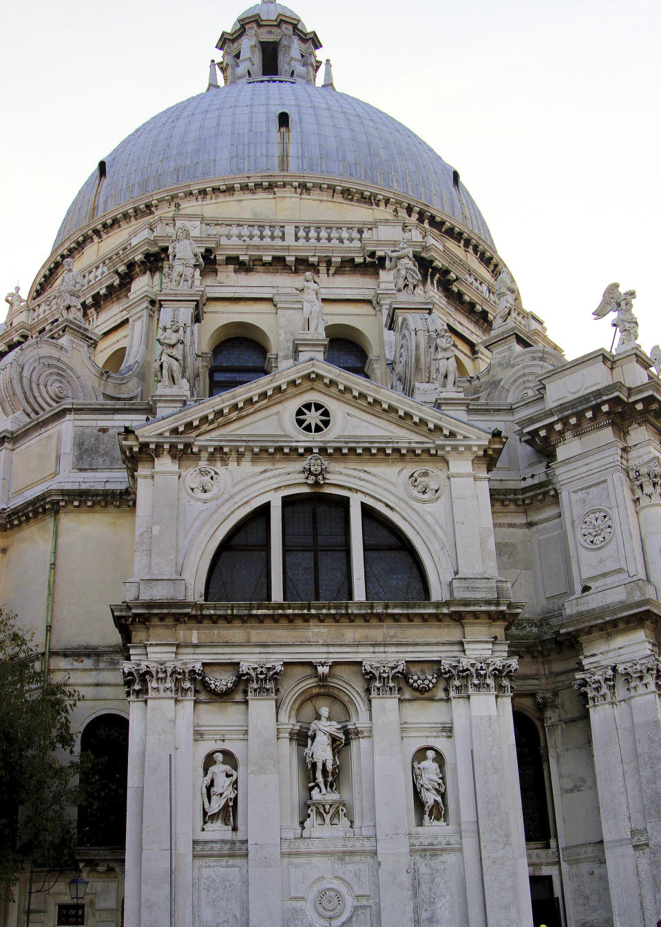 FILE - This Nov. 9, 2013 file photo shows the Basilica di Santa Maria della Salute (St. Mary of Health) at sunset as seen from the water to the south. The church, built after plague broke out in the 17th century, is a fixture of the city's skyline. Venice’s central place in the history of battling pandemics and pestilence will come into focus at this year’s Venice Film Festival, which opens Wednesday, Sept. 1, 2021, with the premiere of Pedro Almodovar’s in-competition “Madres Paralelas” (Parallel Mothers), which he developed during Spain’s 2020 coronavirus lockdown, one of the harshest in the West. (AP Photo/Michelle Locke)