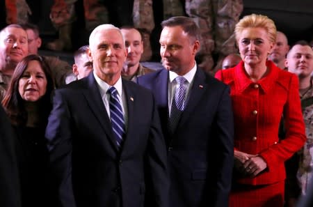 FILE PHOTO: U.S. Vice President Mike Pence, his wife Karen, Polish President Andrzej Duda and his wife Agata Kornhauser-Duda are seen after Pence's arrival at the airport in Warsaw