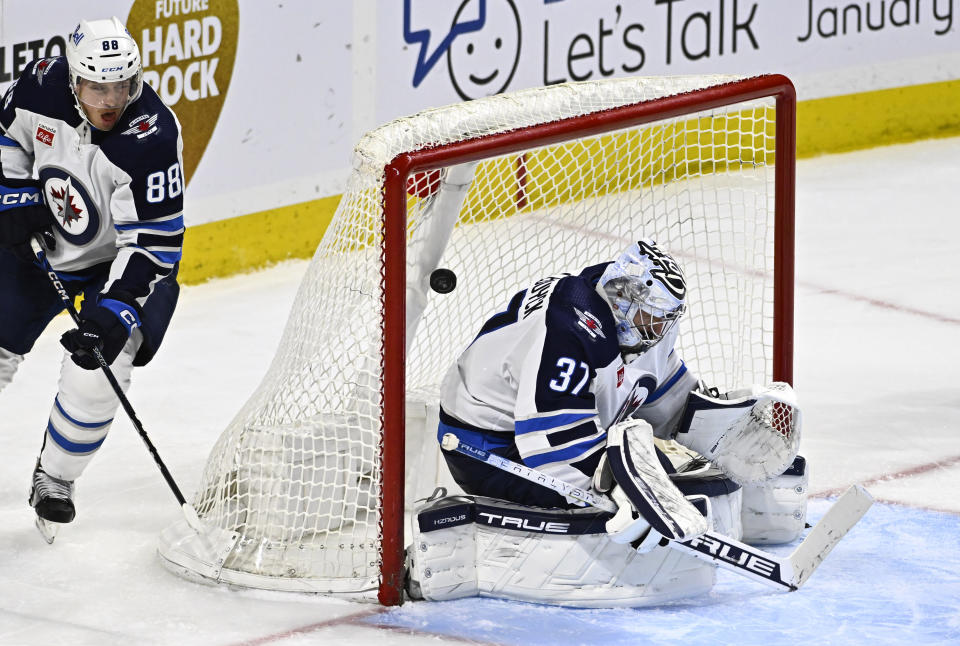 Ottawa Senators left wing Parker Kelly, not shown, scores on Winnipeg Jets goaltender Connor Hellebuyck (37) during the third period of an NHL hockey game, Saturday, Jan. 20, 2024, in Ottawa, Ontario. (Justin Tang/The Canadian Press via AP)