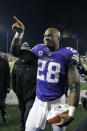 FILE - In this Dec. 27, 2015, file photo, Minnesota Vikings running back Adrian Peterson (28) points to fans as he leaves the field after the Vikings defeated the New York Giants 49-17 in an NFL football game in Minneapolis. Peterson was selected to the 2010s NFL All-Decade Team announced Monday, April 6, 2020, by the NFL and the Pro Football Hall of Fame. (AP Photo/Ann Heisenfelt, File)