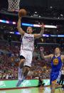 Los Angeles Clippers forward Blake Griffin, left, goes up for a shot as Golden State Warriors forward David Lee defends during the first half in Game 7 of an opening-round NBA basketball playoff series, Saturday, May 3, 2014, in Los Angeles. (AP Photo/Mark J. Terrill)