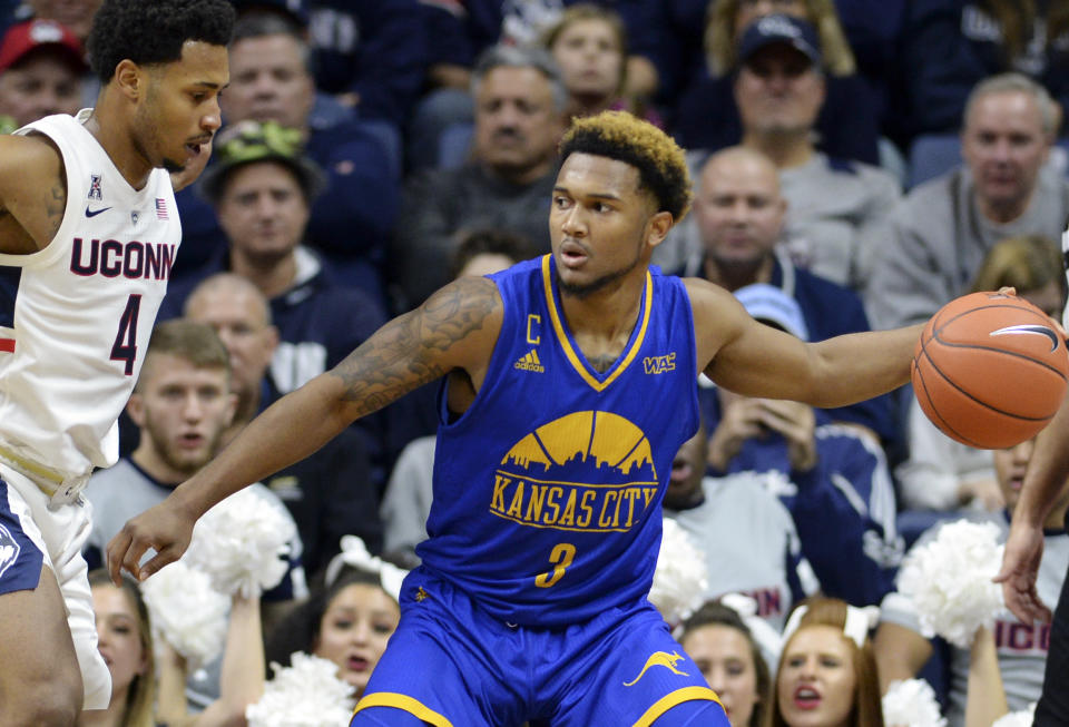 FILE - Kansas City guard Brandon McKissic (3) looks to pass during the second half of an NCAA college basketball game against Connecticut in Storrs, Conn., in this Sunday, Nov. 11, 2018, file photo. Florida coach Mike White took the first step in a significant rebuilding process Friday, April 2, 2021. White got a commitment from Kansas City guard Brandon McKissic. The senior led the Roos with 17.2 points a game this season.(AP Photo/Stephen Dunn, File)