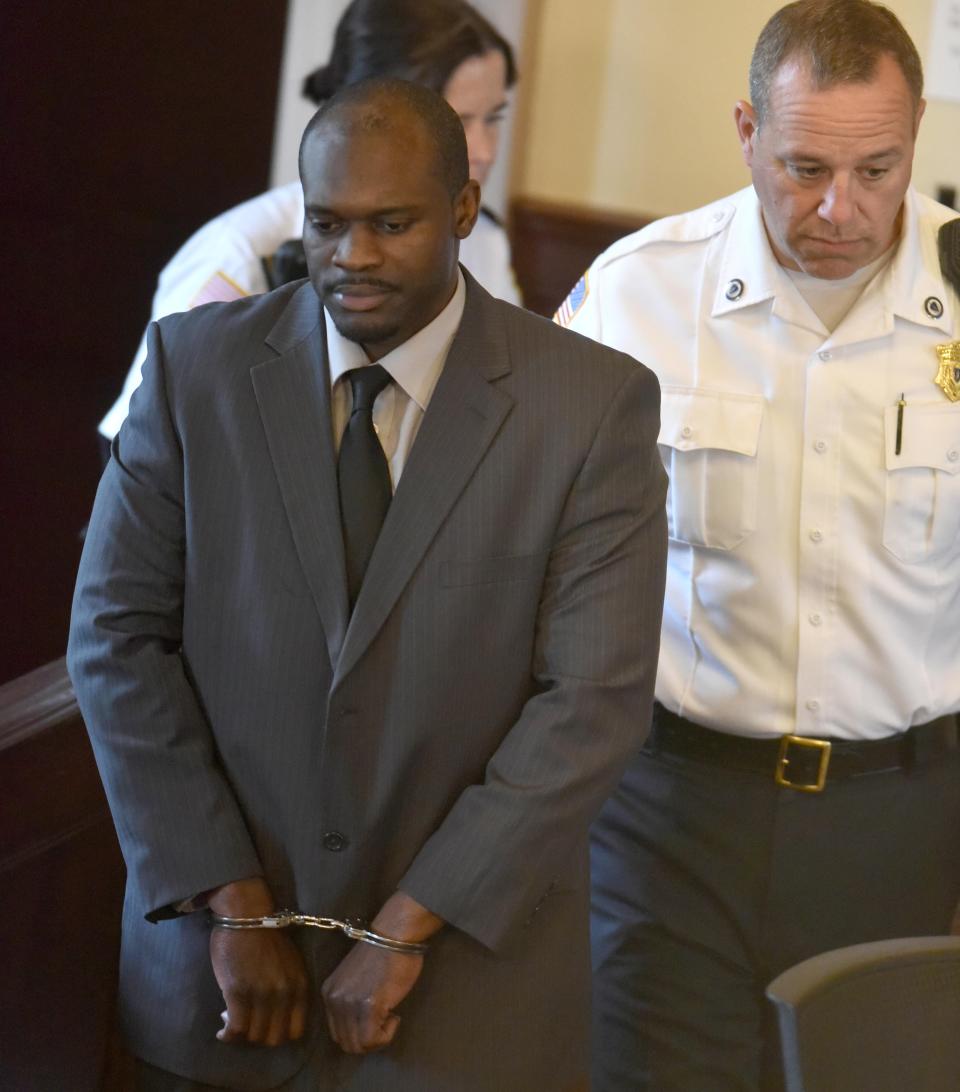 William Hayes Jr. is escorted into the main courtroom of Barnstable Superior CourtTuesday as his trial gets underway.