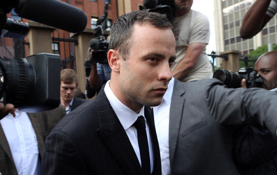 Oscar Pistorius leaves the high court in Pretoria, South Africa, Wednesday, April 9, 2014. Pistorius is charged with murder for shooting dead his girlfriend, Reeva Steenkamp, on Valentines Day in 2013. (AP Photo/Themba Hadebe)