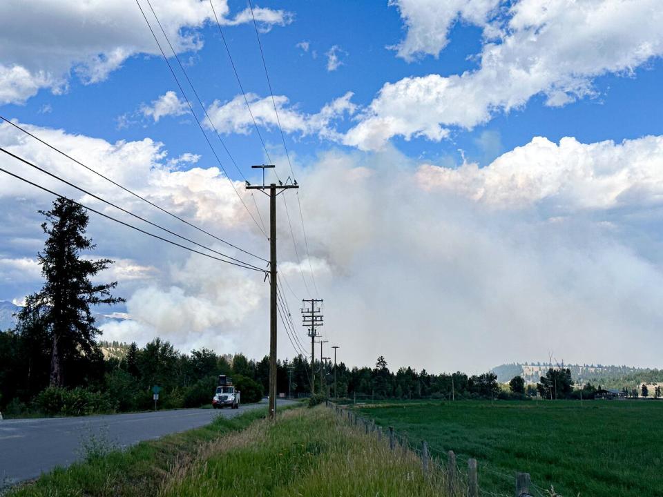 Pictured is a large plume of smoke from the St. Mary's River wildfire as seen from the community of Aq'am on July 17, 2023. 