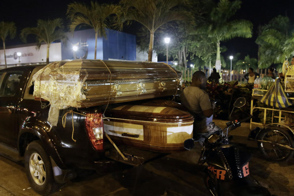 Coffins for the bodies of inmates killed in a riot at the Litoral penitentiary sit on a truck out side the morgue in Guayaquil, Ecuador, Wednesday, September 29, 2021. President Guillermo Lasso said in a press conference that the dead are so far 116. (AP Photo/Angel DeJesus)