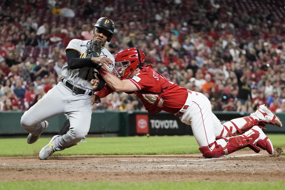 Cincinnati Reds catcher Tyler Stephenson, right, tags out Pittsburgh Pirates' Ke'Bryan Hayes during the seventh inning of a baseball game Saturday, Sept. 23, 2023, in Cincinnati. (AP Photo/Joshua A. Bickel)