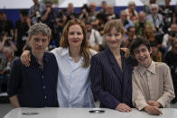 Swann Arlaud, from left, director Justine Triet, Sandra Huller and Milo Machado Graner pose for photographers at the photo call for the film 'Anatomy of a Fall' at the 76th international film festival, Cannes, southern France, Monday, May 22, 2023. (AP Photo/Daniel Cole)