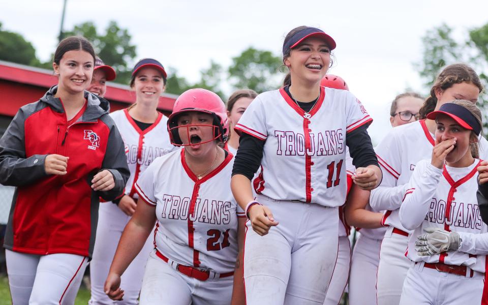 Bridgewater-Raynham's Ava Selter, No. 21, celebrates with teammates after hitting a walk-off home run during a game in the Division 1 state tournament against Natick on Monday, June 5, 2023.