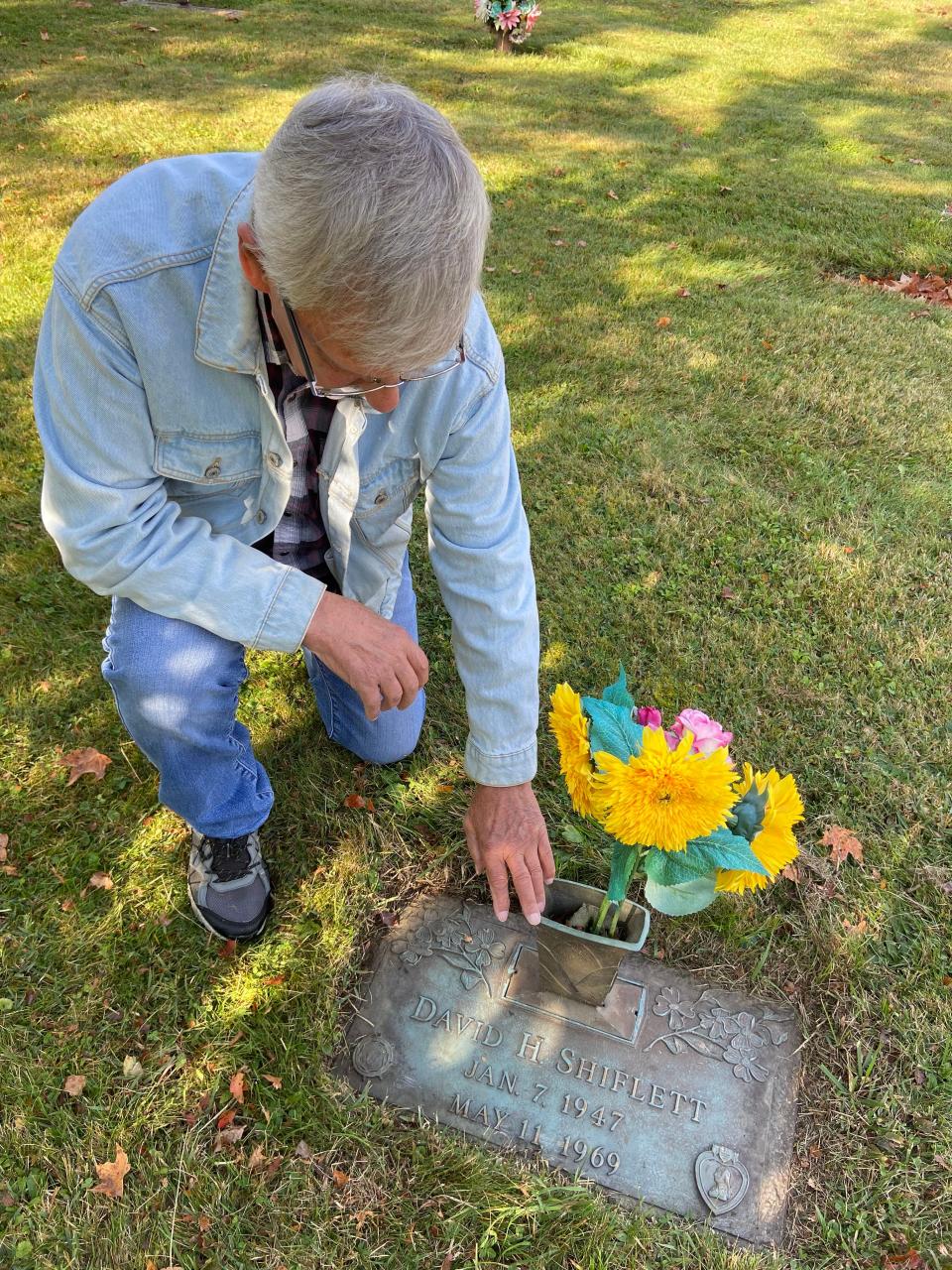 Dean visits his friend's grave at Mountain State Memorial Cemetery in Elkins, West Virginia.