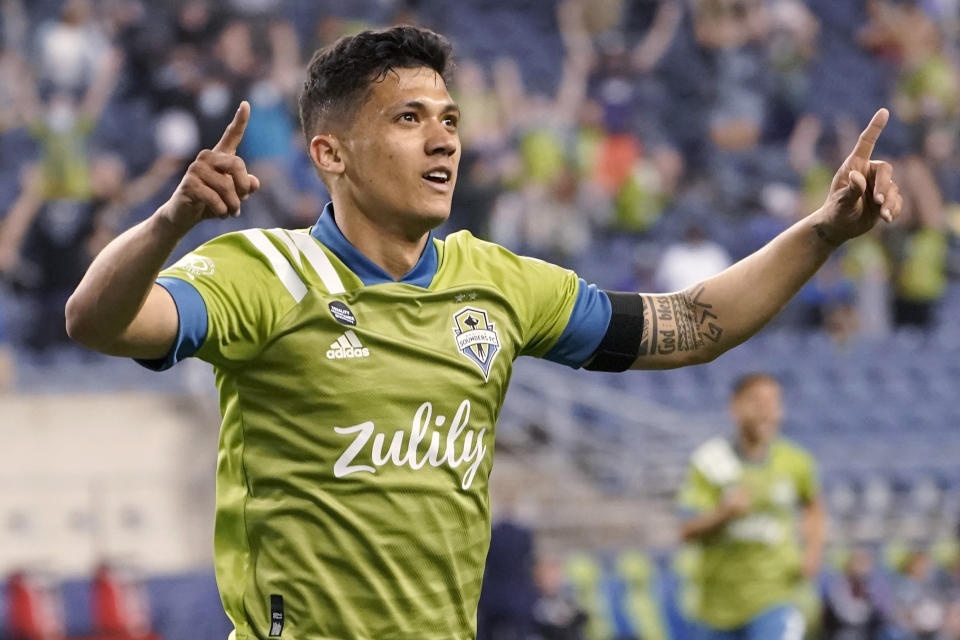 Seattle Sounders forward Fredy Montero celebrates after scoring a goal against Minnesota United during the second half of an MLS soccer match Friday, April 16, 2021, in Seattle. The Sounders won 4-0. (AP Photo/Ted S. Warren)