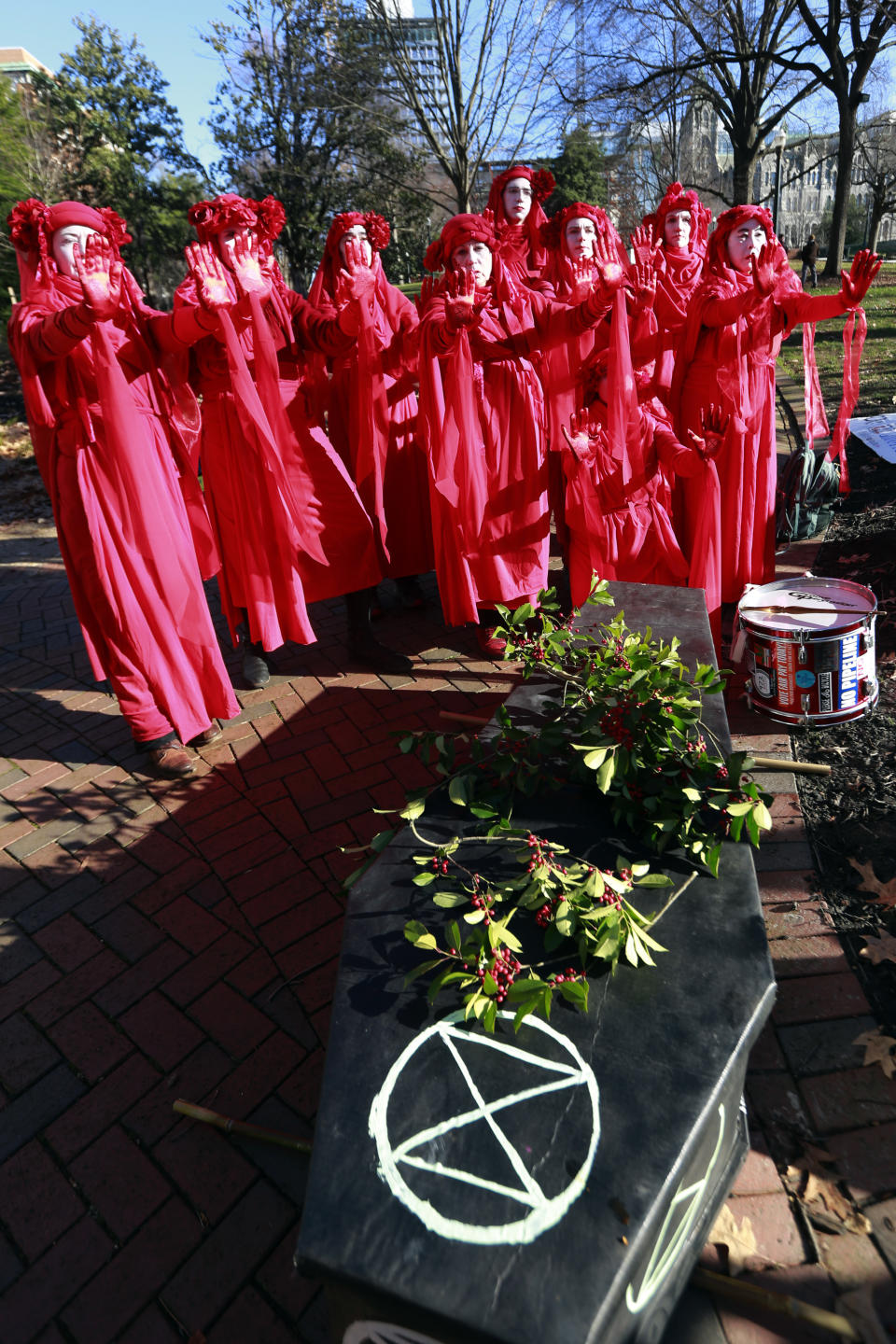 Extinction Rebellion climate protesters demonstrate outside the Virginia State Capitol in Richmond, Va., Wednesday, Jan. 8, 2020. The 2020 session of the Virginia General Assembly begins Wednesday. (AP Photo/Steve Helber)